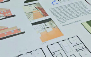 A photo of a building plan with the Home Builders Association of Lincoln logo